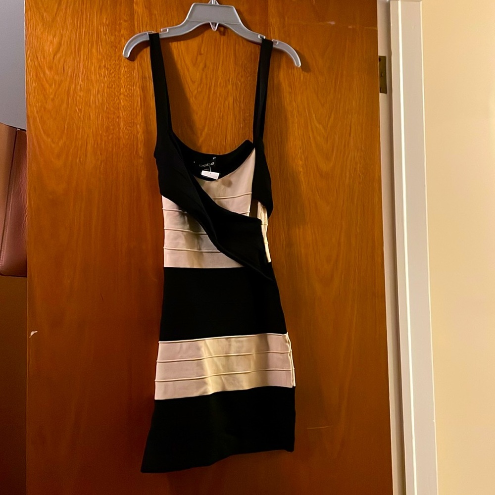 Bebé size small body hugging mini dress.
